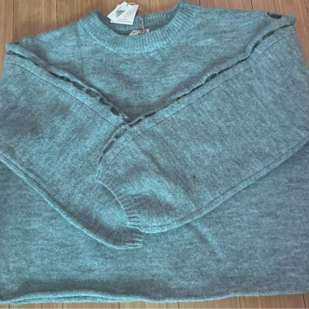 Beautiful teal blue wool sweater - one size.  Cut out holes on sleeves.